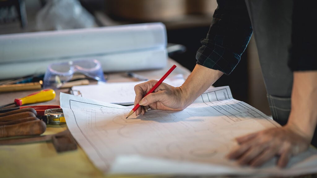 Manufacturing drafting preparation with production drawings, measurements and material samples